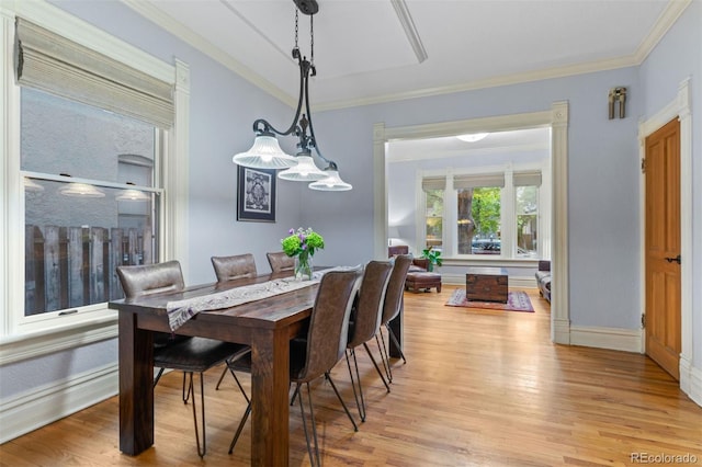848 S Emerson St, Denver, CO 80209 - dining space featuring light wood-style flooring, crown molding, and baseboards