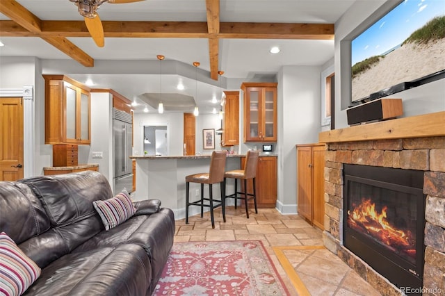 848 S Emerson St, Denver, CO 80209 - living room with a fireplace, recessed lighting, beam ceiling, stone tile flooring, and baseboards