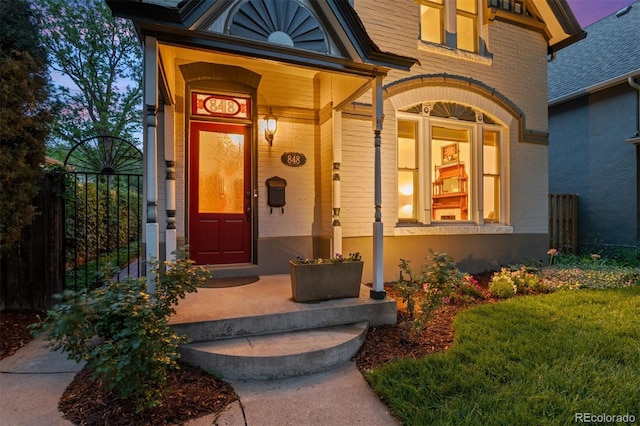 848 S Emerson St, Denver, CO 80209 - view of exterior entry featuring brick siding and covered porch