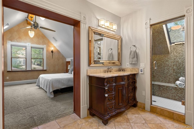 848 S Emerson St, Denver, CO 80209 - ensuite bathroom featuring vanity, a ceiling fan, a stall shower, vaulted ceiling, and tile patterned floors