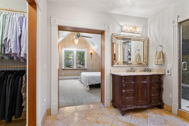 848 S Emerson St, Denver, CO 80209 - full bath featuring vanity, a walk in closet, baseboards, and a ceiling fan