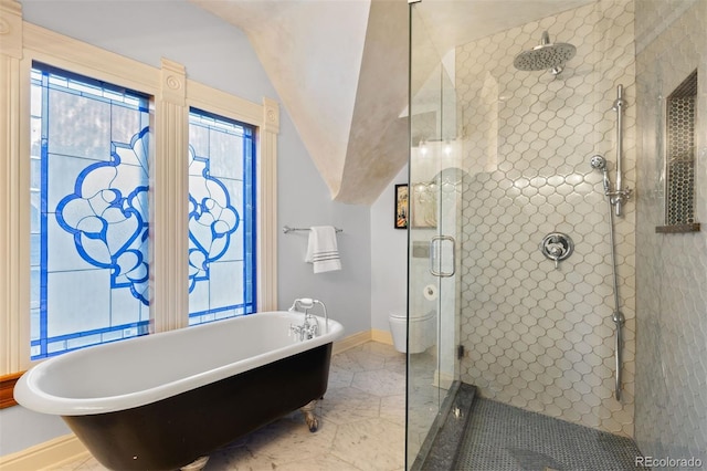 848 S Emerson St, Denver, CO 80209 - bathroom featuring a shower stall, a soaking tub, marble look tiles, baseboards, and toilet