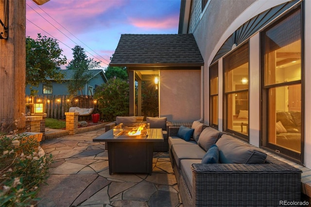 848 S Emerson St, Denver, CO 80209 - patio terrace at dusk with an outdoor living space with a fire pit and a patio area