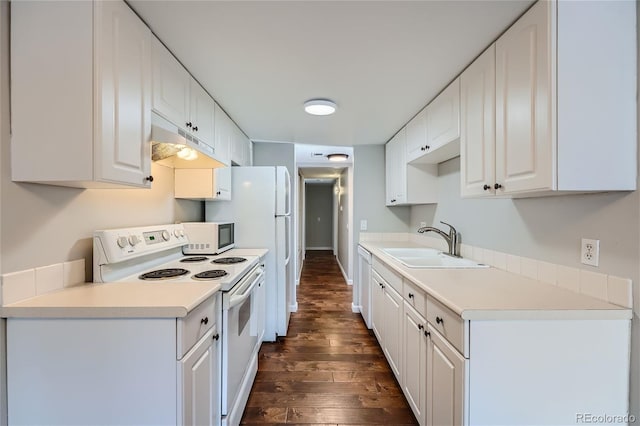 kitchen featuring white cabinets, sink, white appliances, and dark wood-type flooring