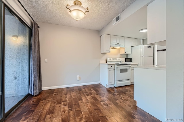 kitchen with white cabinets, dark hardwood / wood-style flooring, white appliances, and a textured ceiling