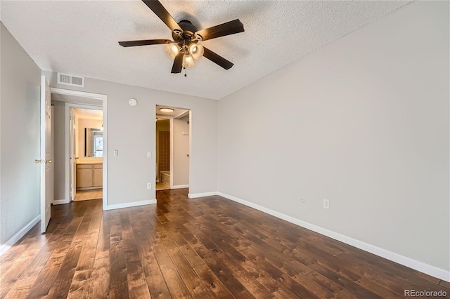 unfurnished bedroom featuring hardwood / wood-style flooring, ceiling fan, a textured ceiling, and ensuite bathroom