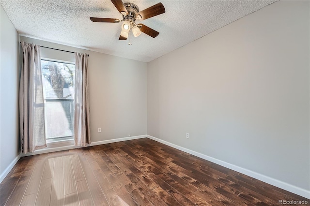 spare room with hardwood / wood-style flooring, a healthy amount of sunlight, and a textured ceiling