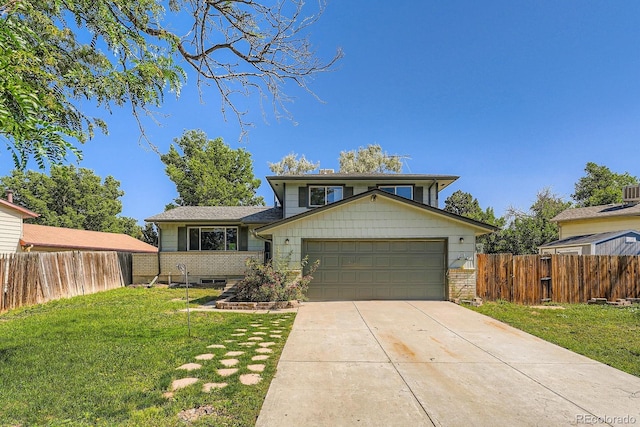 16623 E Asbury Pl, Aurora, CO 80013 - tri-level home featuring an attached garage and concrete driveway