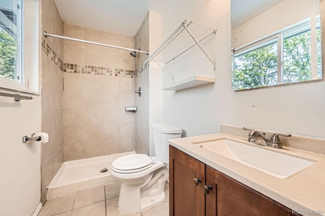 16623 E Asbury Pl, Aurora, CO 80013 - bathroom with tile patterned floors, vanity, and a tile shower