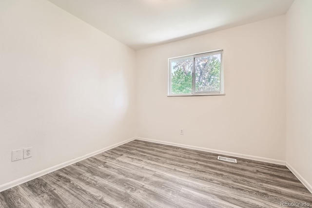 16623 E Asbury Pl, Aurora, CO 80013 - empty room with wood finished floors and baseboards