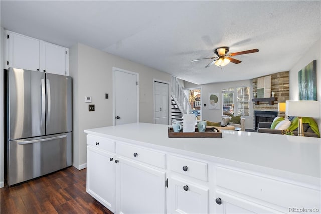 kitchen featuring freestanding refrigerator, light countertops, dark wood finished floors, and ceiling fan