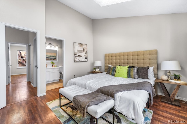 bedroom with baseboards and wood finished floors