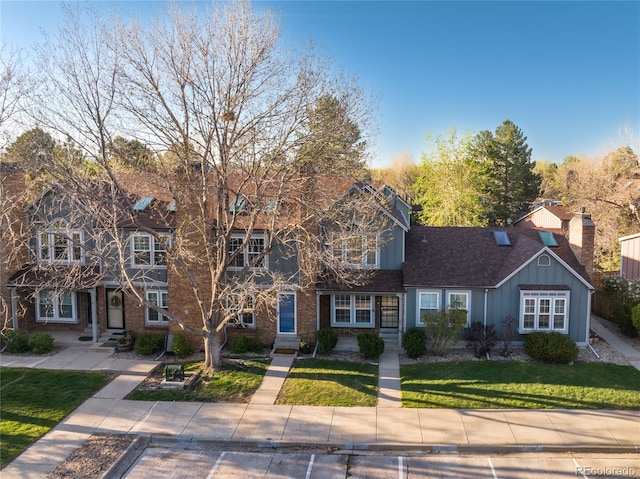 view of front of property with board and batten siding and a front yard