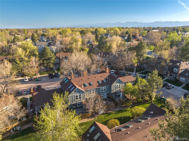 drone / aerial view featuring a mountain view and a residential view