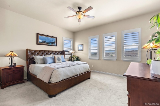 bedroom with baseboards, light colored carpet, and ceiling fan