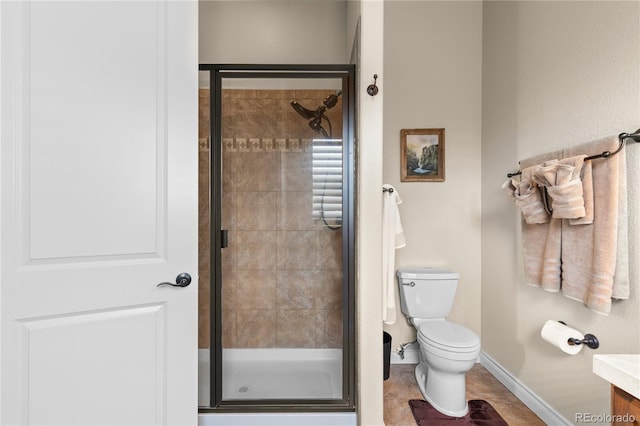 full bathroom with toilet, vanity, baseboards, and a shower stall