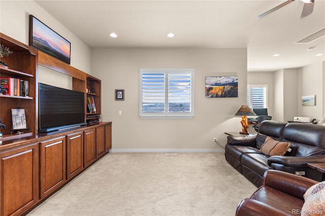 living area with light carpet, baseboards, recessed lighting, and a ceiling fan