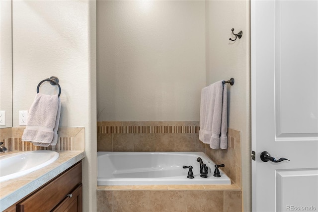 full bathroom with vanity and a garden tub