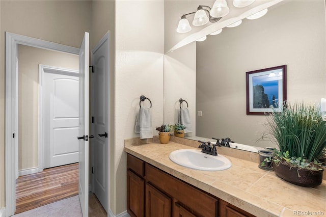 bathroom featuring tile patterned flooring and vanity