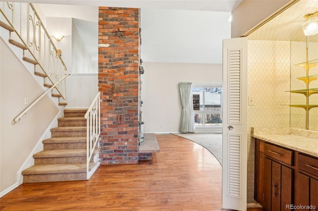 interior space featuring baseboards and wood finished floors