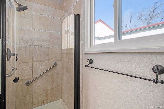 full bathroom featuring a shower stall