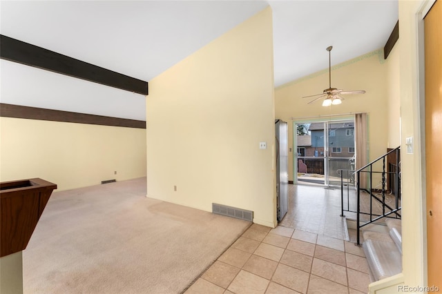 interior space with tile patterned floors, visible vents, beam ceiling, stairway, and carpet floors