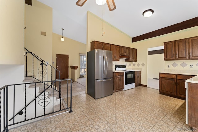 kitchen featuring white electric stove, freestanding refrigerator, light countertops, under cabinet range hood, and tasteful backsplash