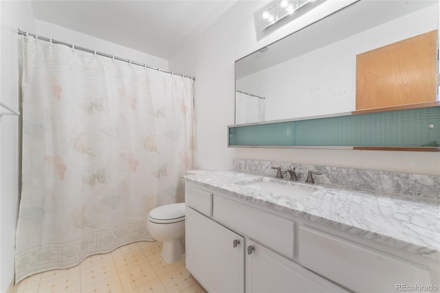 full bathroom featuring vanity, tile patterned floors, and toilet