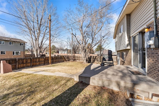 view of yard featuring a patio area and a fenced backyard