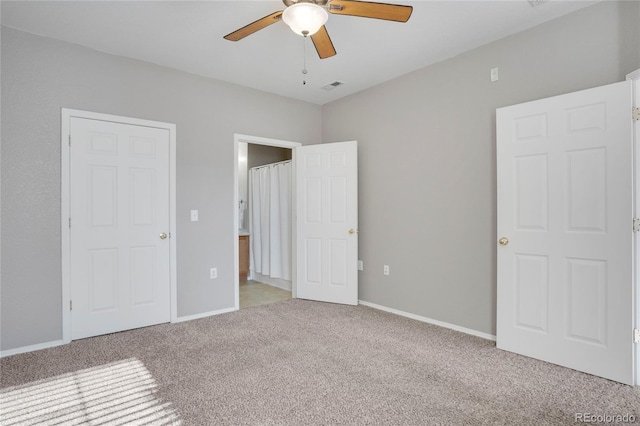 unfurnished bedroom with baseboards, visible vents, ceiling fan, and light colored carpet