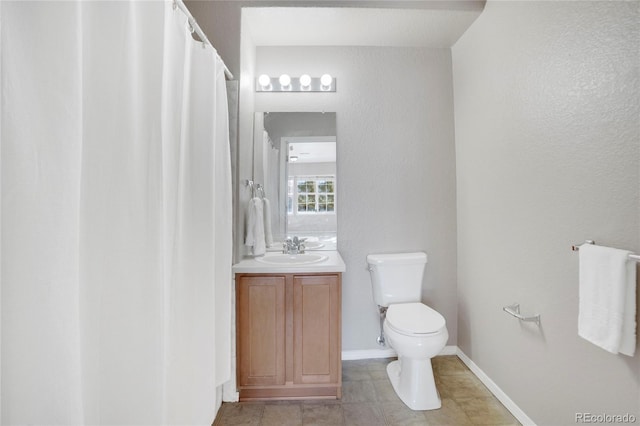 full bath with toilet, baseboards, and vanity