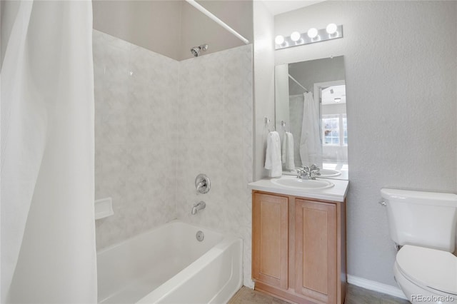 full bathroom featuring shower / bath combination with curtain, vanity, and toilet