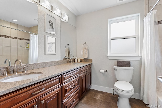 full bathroom with toilet, baseboards, a shower with curtain, double vanity, and tile patterned flooring