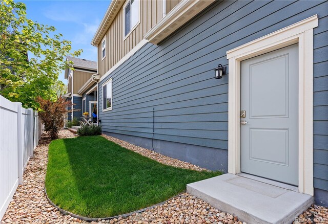 4589 Quandary Peak St, Brighton, CO 80601 - entrance to property featuring board and batten siding