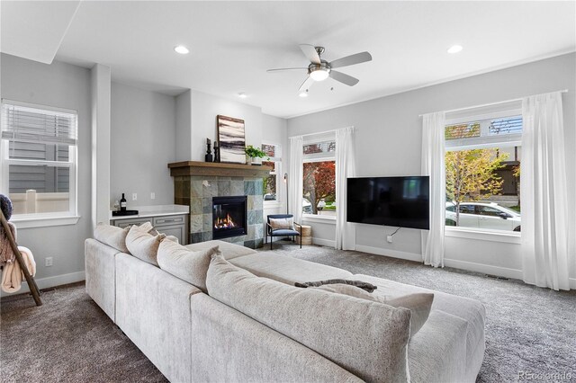 4589 Quandary Peak St, Brighton, CO 80601 - living room with carpet, ceiling fan, a tile fireplace, and recessed lighting