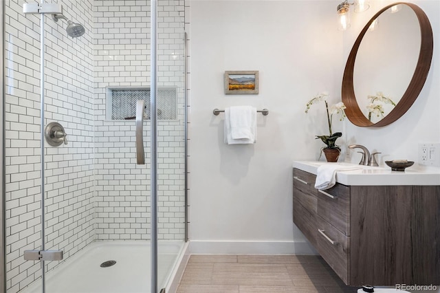 bathroom featuring vanity, an enclosed shower, and tile patterned flooring