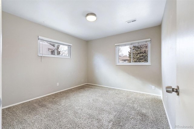 unfurnished room with carpet floors