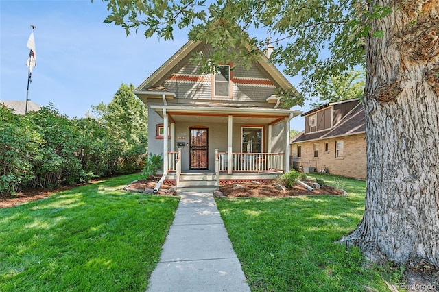 victorian home featuring a porch and a front yard