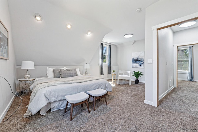 carpeted bedroom featuring recessed lighting, vaulted ceiling, and baseboards