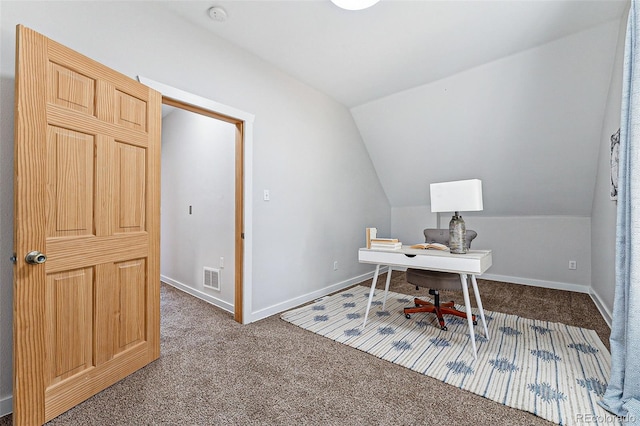 office space featuring lofted ceiling, carpet, visible vents, and baseboards