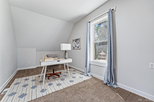 office space with vaulted ceiling, carpet, and baseboards