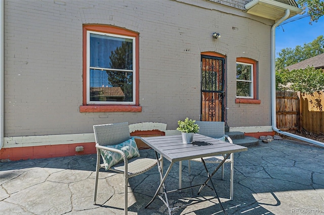 view of patio featuring fence