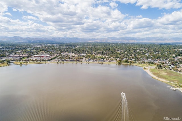 birds eye view of property with a water and mountain view