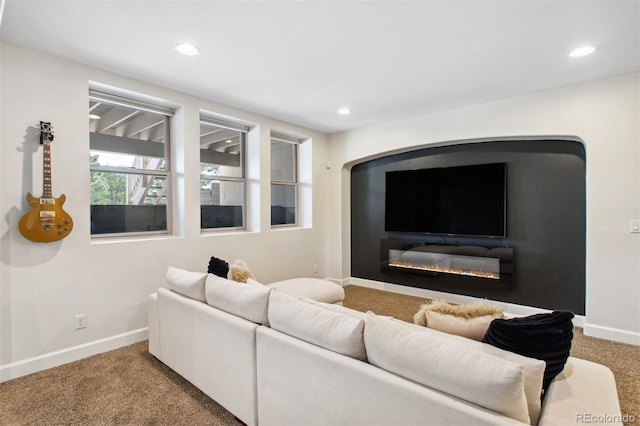 living area with recessed lighting, baseboards, and carpet floors