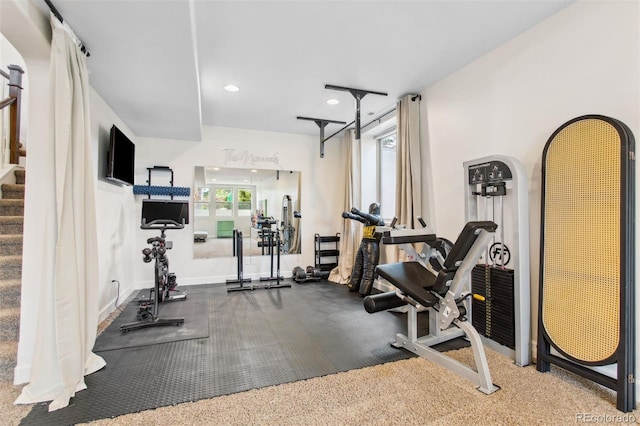 exercise room with recessed lighting and baseboards