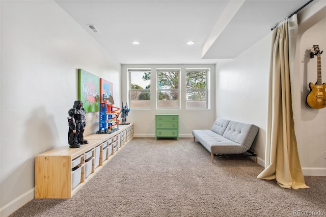 living area featuring recessed lighting, carpet, and baseboards