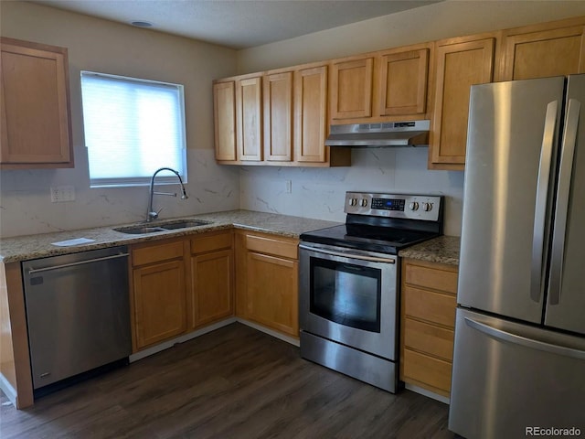 15703 E 13th Pl, Aurora, CO 80011 - kitchen featuring appliances with stainless steel finishes, under cabinet range hood, dark wood-style flooring, decorative backsplash, and light stone counters