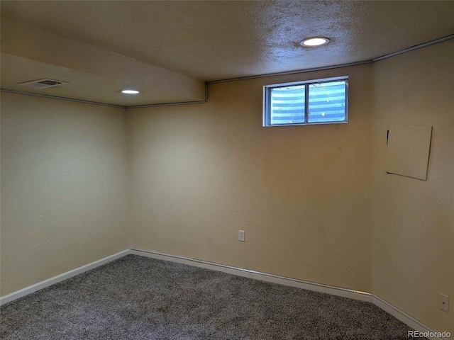 15703 E 13th Pl, Aurora, CO 80011 - below grade area with carpet floors, a textured ceiling, and recessed lighting