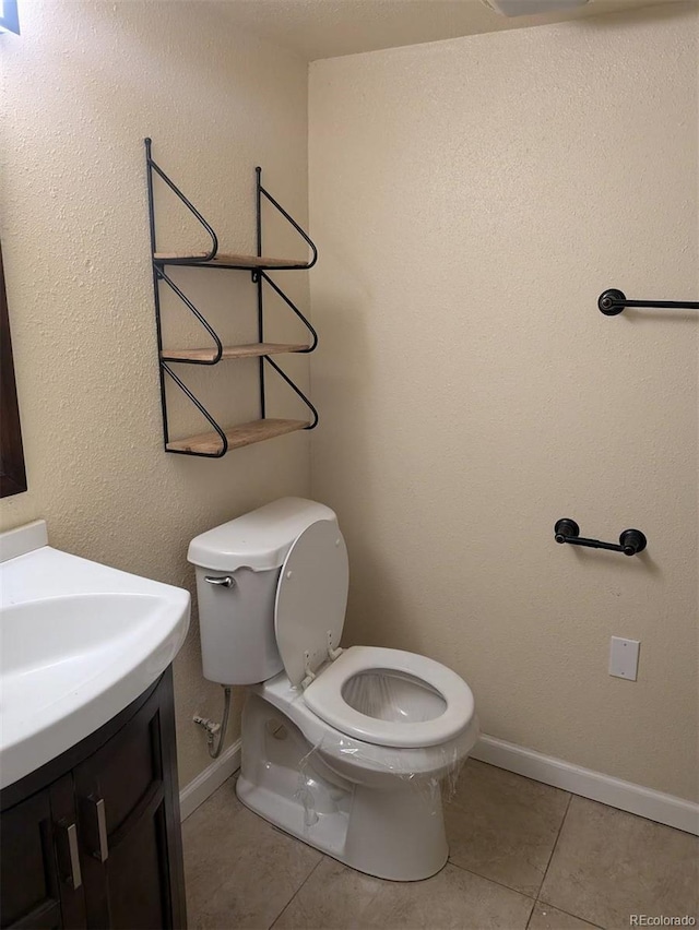 15703 E 13th Pl, Aurora, CO 80011 - bathroom with tile patterned flooring and vanity