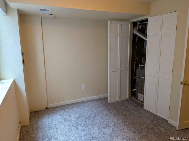 15703 E 13th Pl, Aurora, CO 80011 - unfurnished bedroom featuring light carpet and baseboards